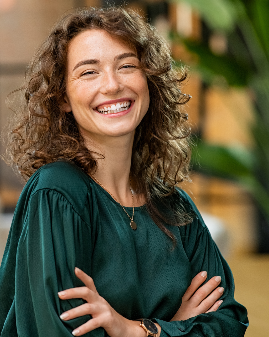 A confident woman leader portrait - fulfilled following leadership coaching with Purpose Panda
