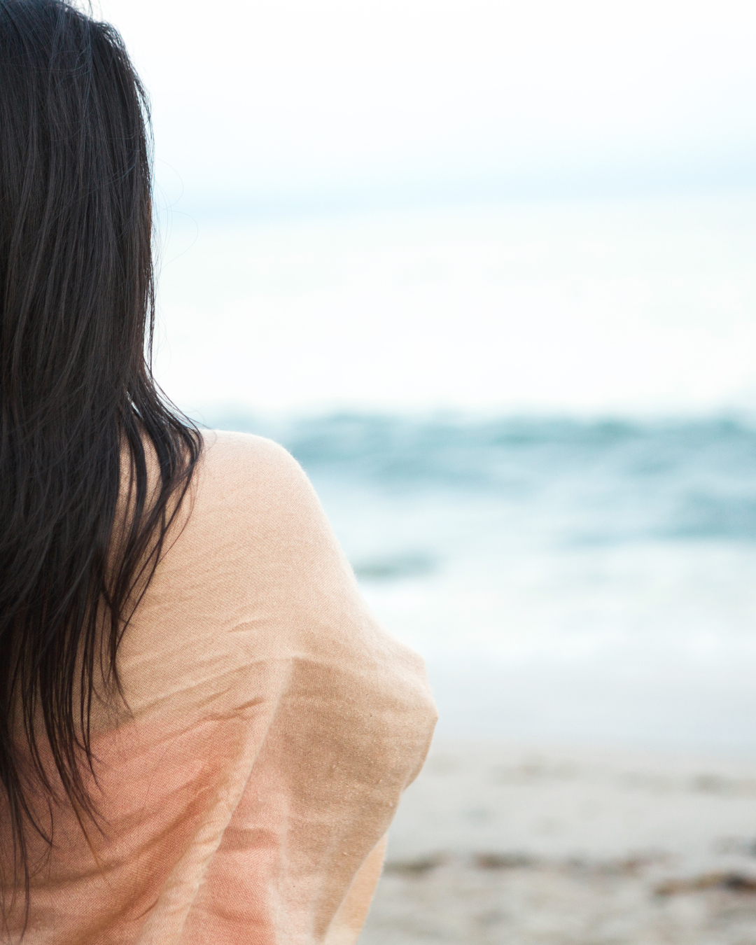 Woman looking out to sea